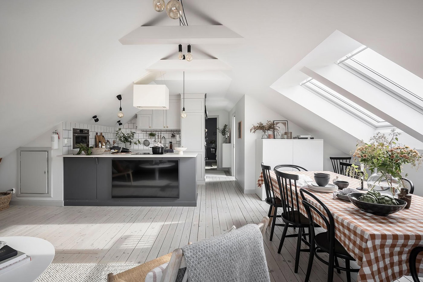 Attic apartment with a living kitchen and a blue bedroom