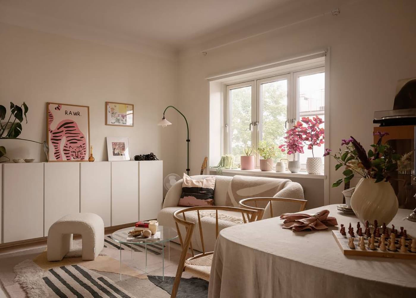 A soft color palette studio home with an alcove sleeping space